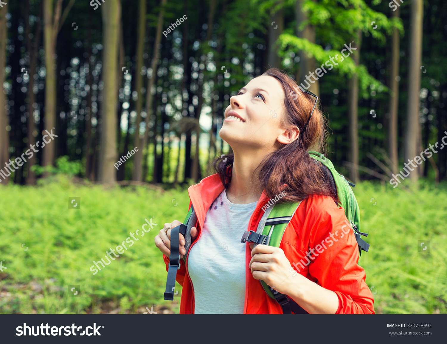 Woman Hiker In Forest Smiling Looking Up Enjoying Freedom. Positive ...