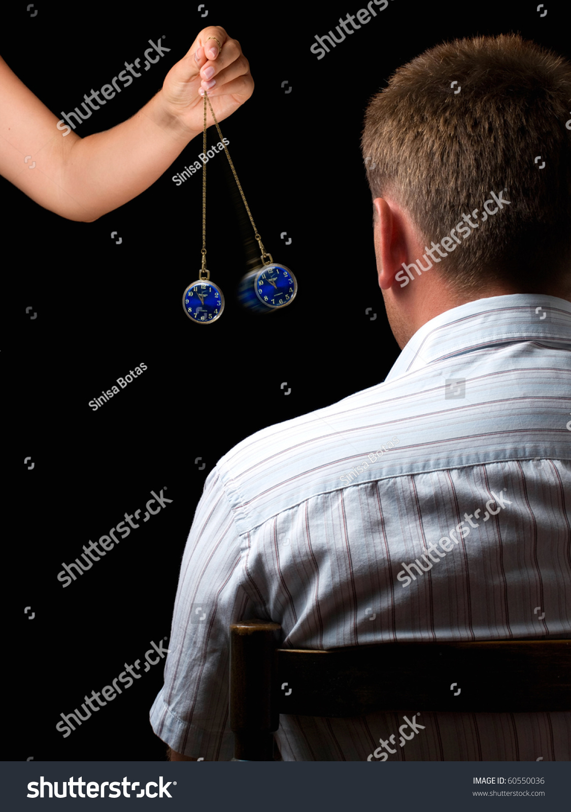 Woman Hypnotizes Man Swinging Watch During Stock Photo 60550036 ...