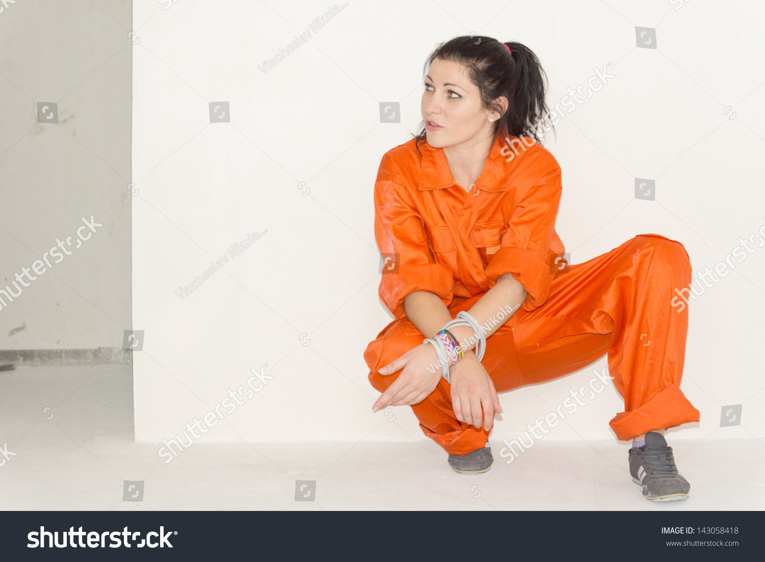 Woman Orange Overalls Crouching Down House Stock Photo 143058418 ...