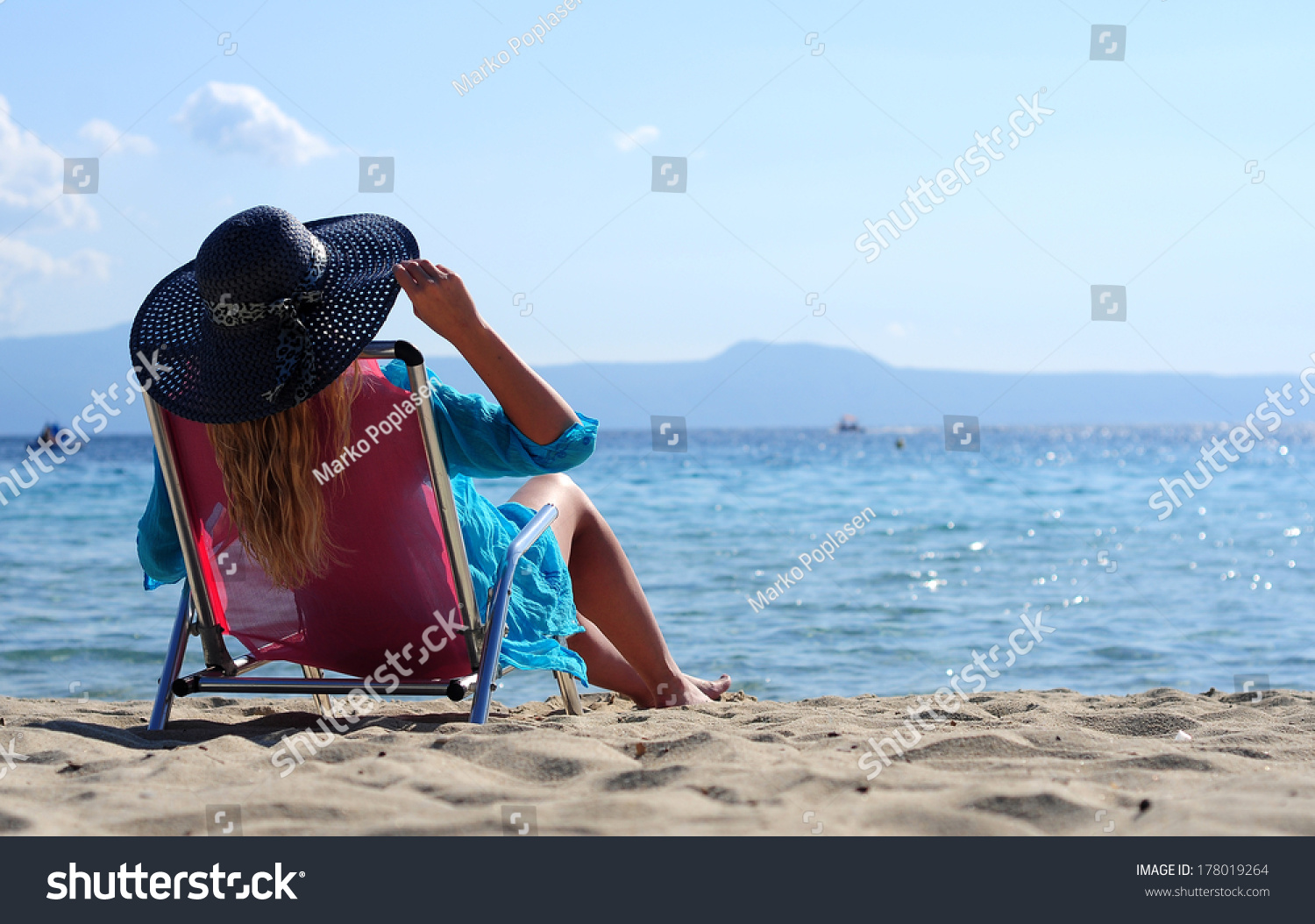 Woman Is Lying On A Deck Chair Stock Photo 178019264 : Shutterstock