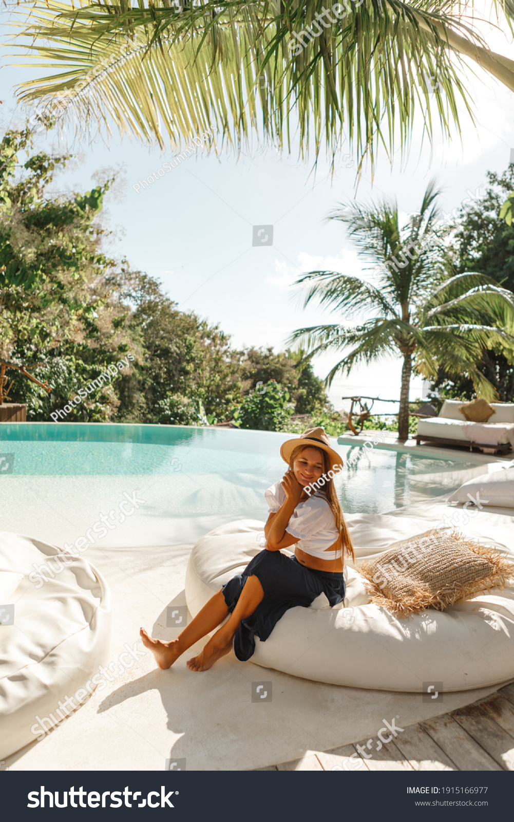 Woman Relaxing On Luxurious Sunbed Under Stock Photo 1915166977 ...