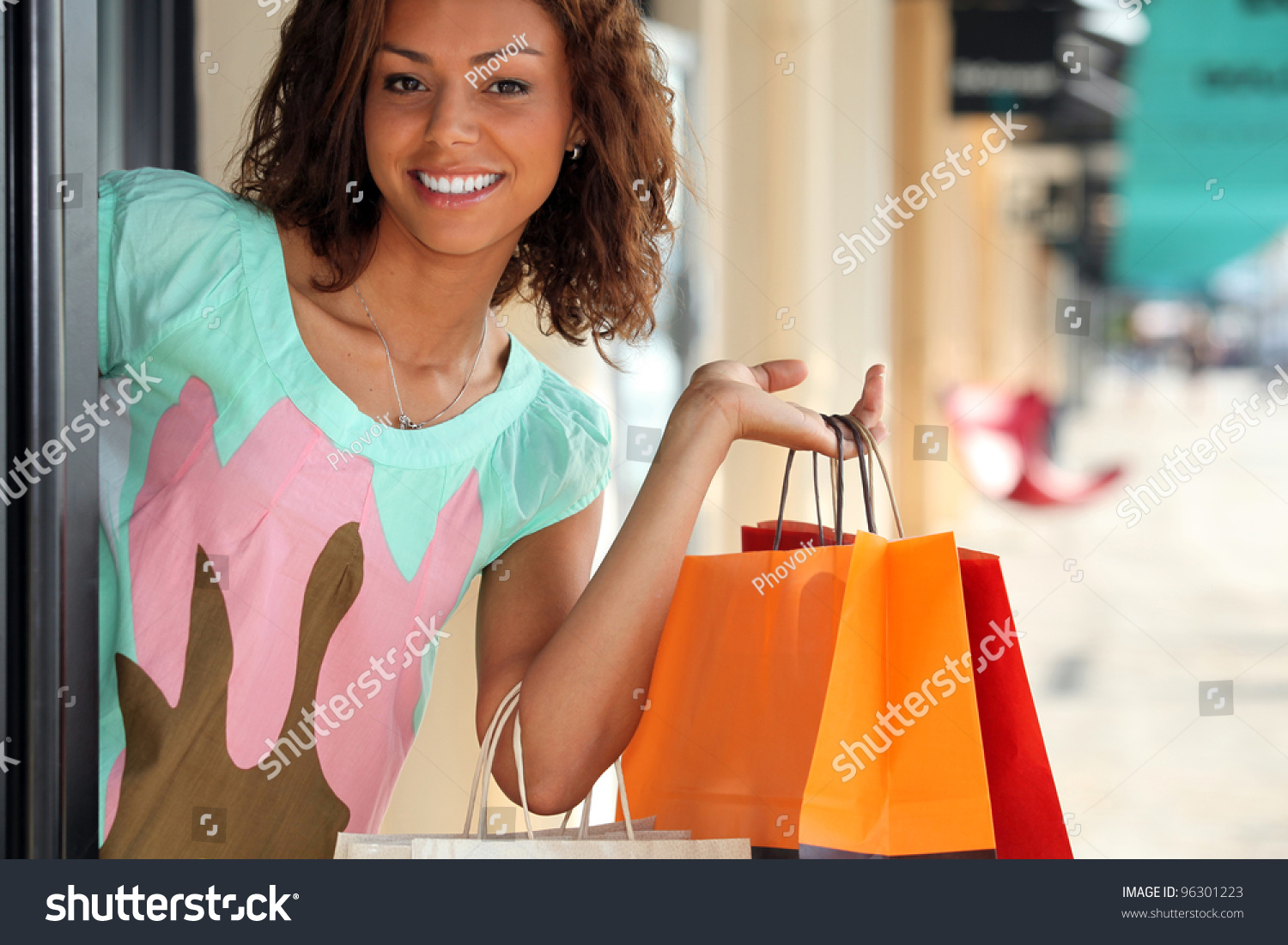 Woman Leaving Store With Shopping Bags Stock Photo 96301223 : Shutterstock