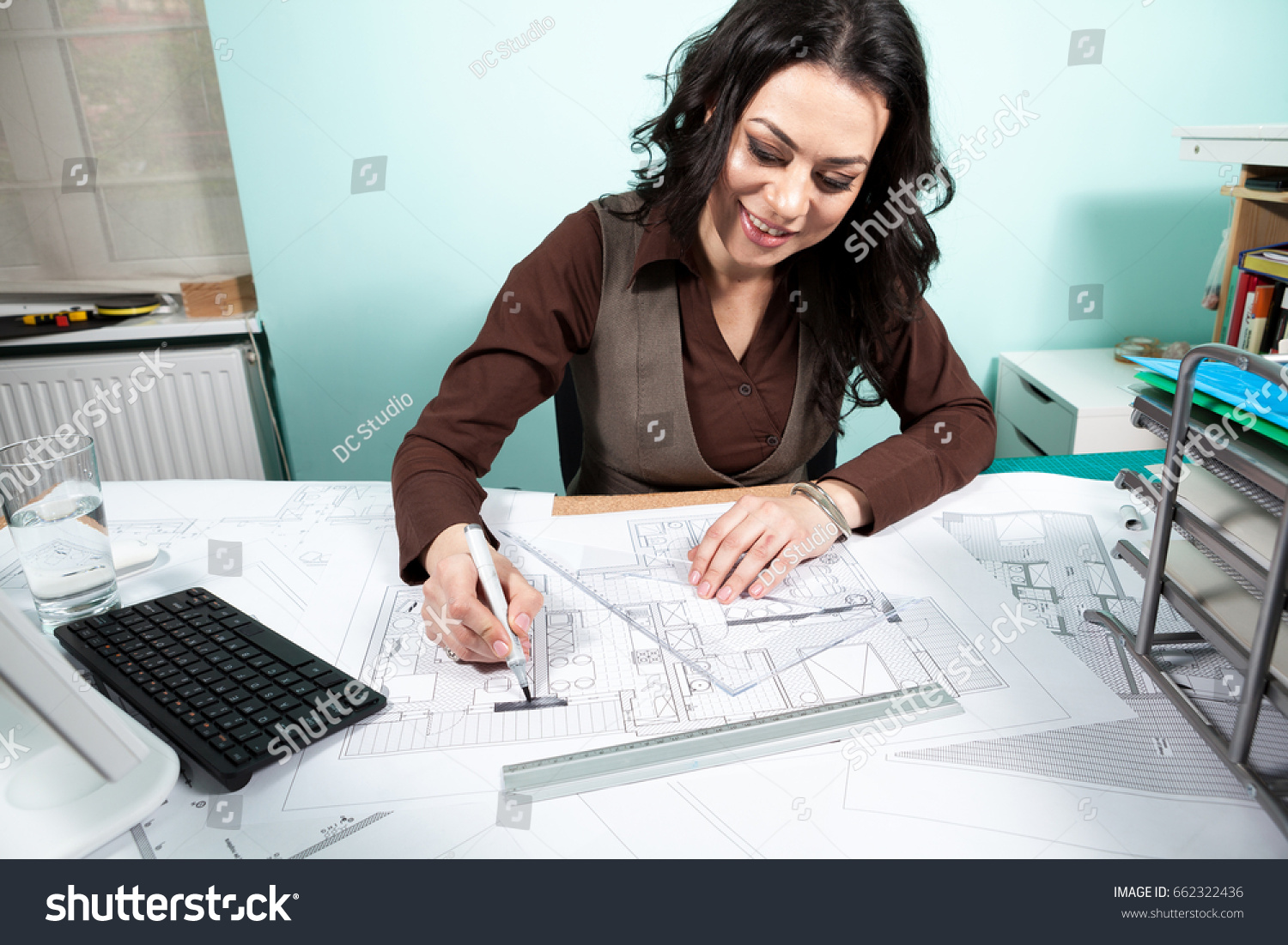 Woman On Working Desk Blueprints Front Royalty Free Stock Image