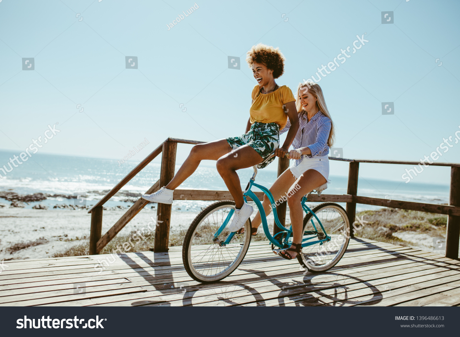 riding on the handlebars of a bike