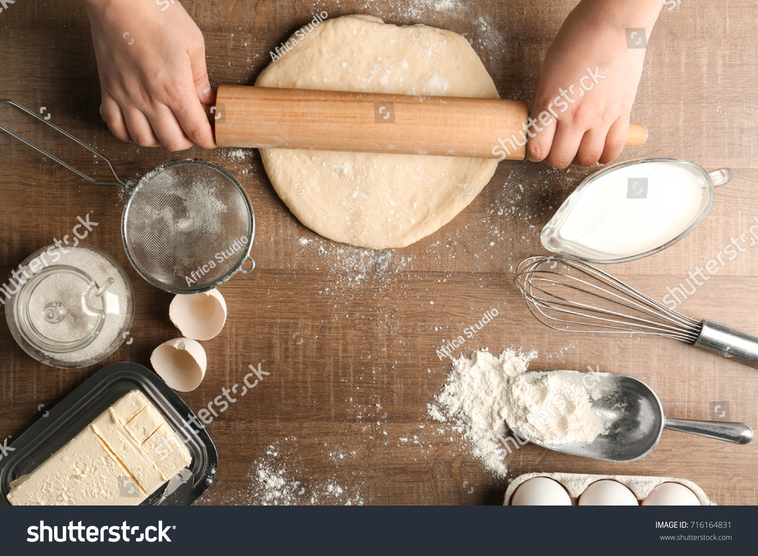 Woman Rolling Dough On Kitchen Table Stock Photo Edit Now 716164831