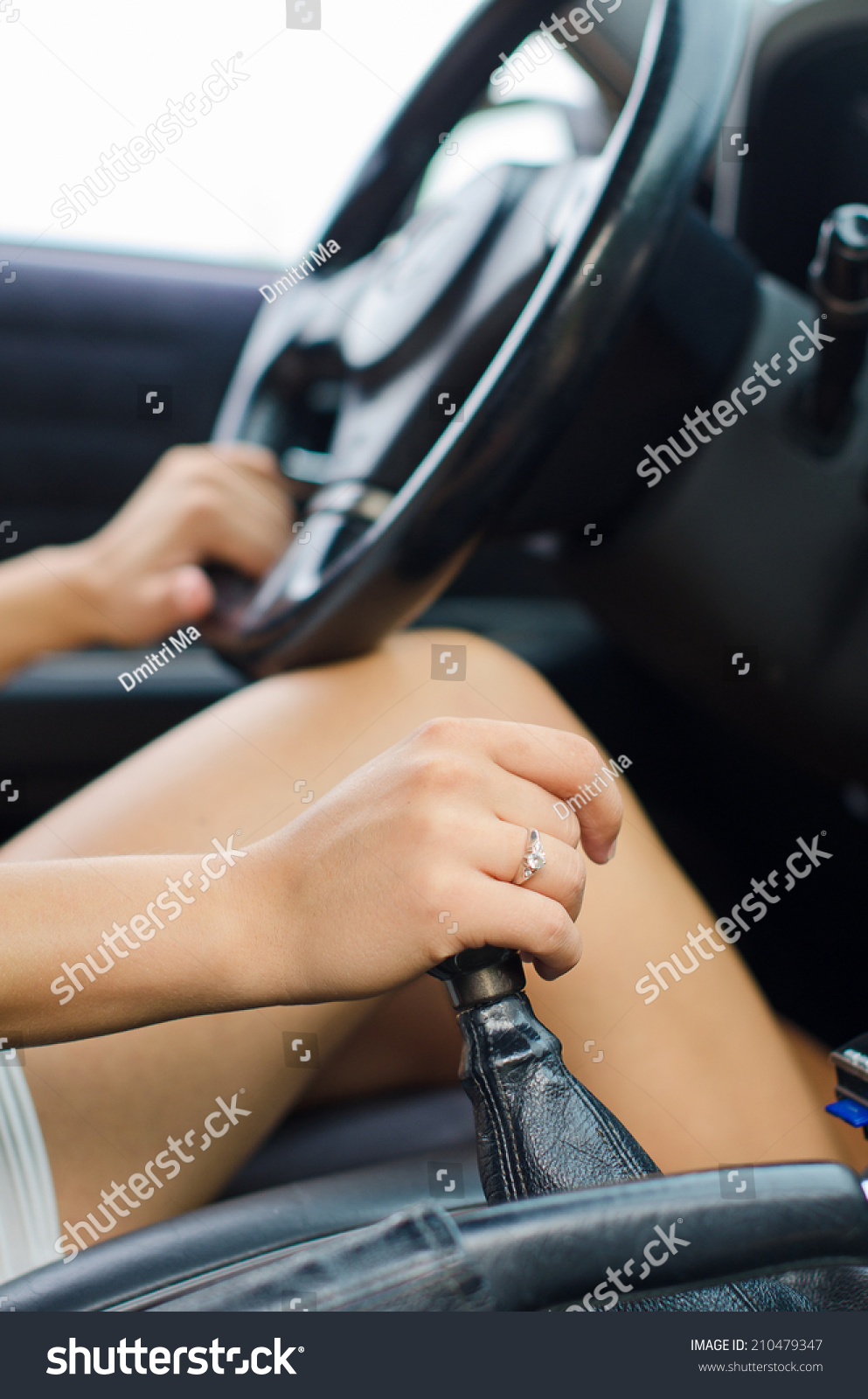WomanS Hand Driving A Car