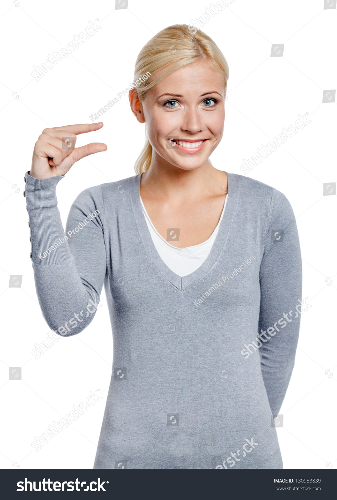 Woman Showing Small Amount Of Something With Fingers, Isolated On White ...