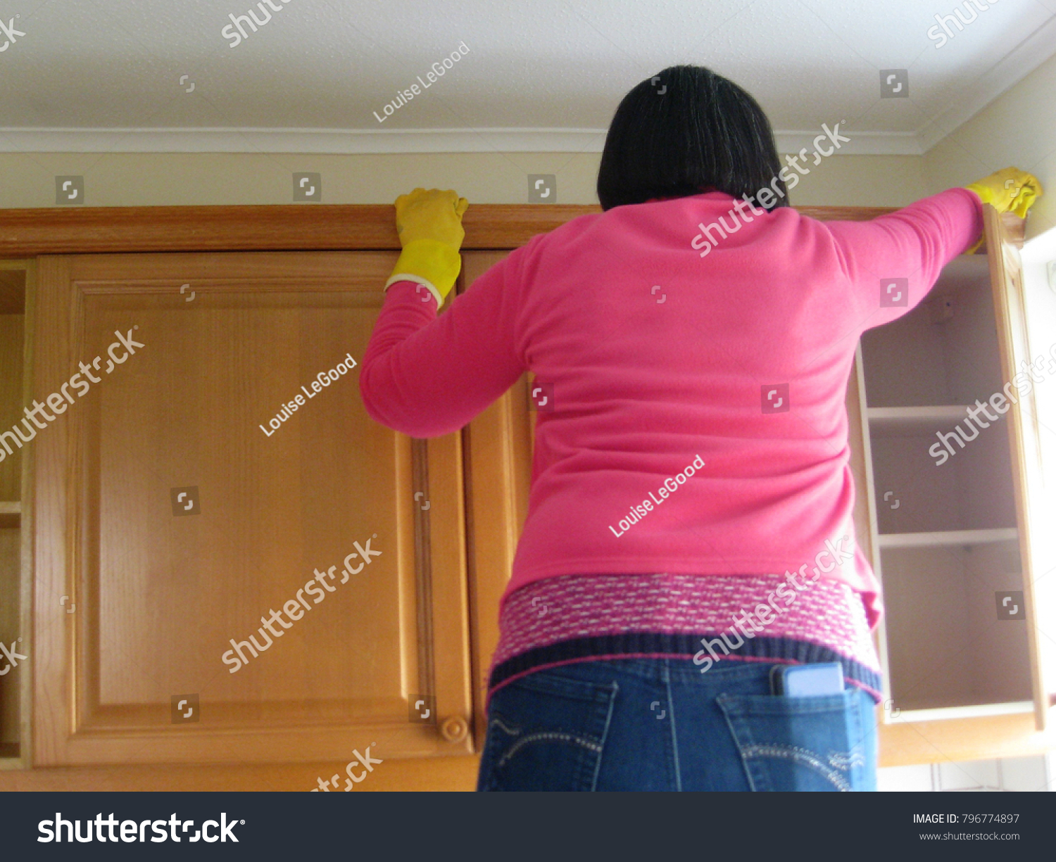 Woman Spring Cleaning Kitchen Cupboards Inside Stock Photo Edit