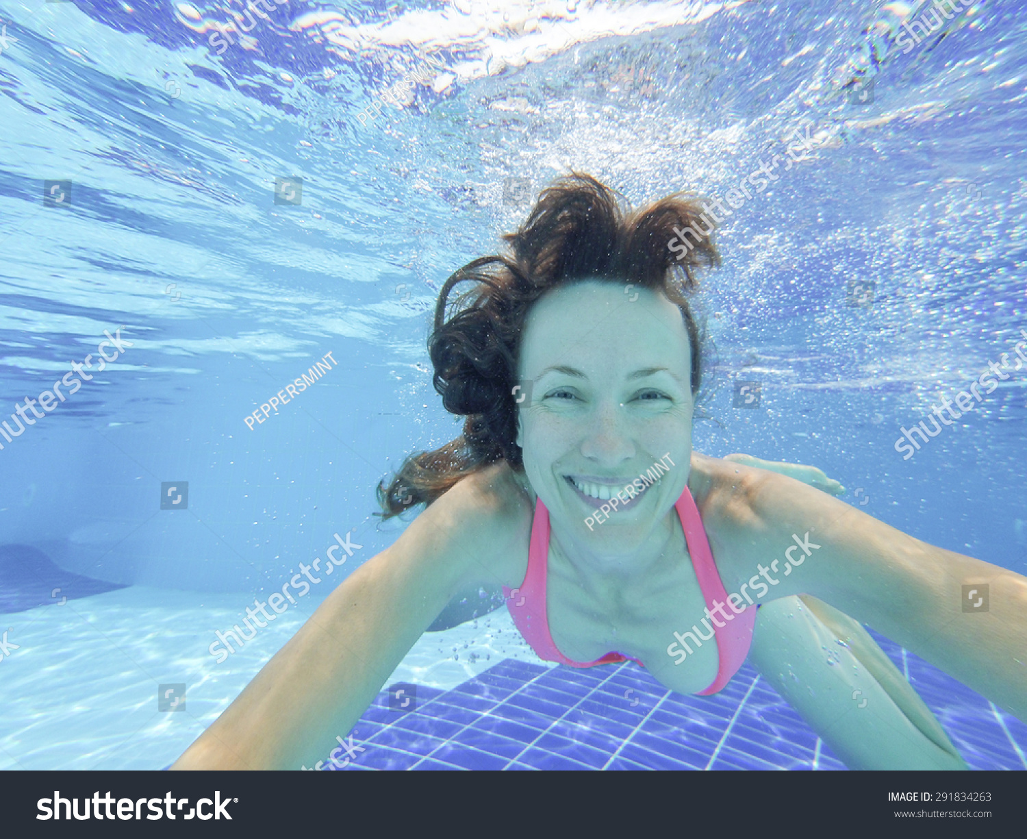 Woman Swimming Underwater Pool Smiling Selfie