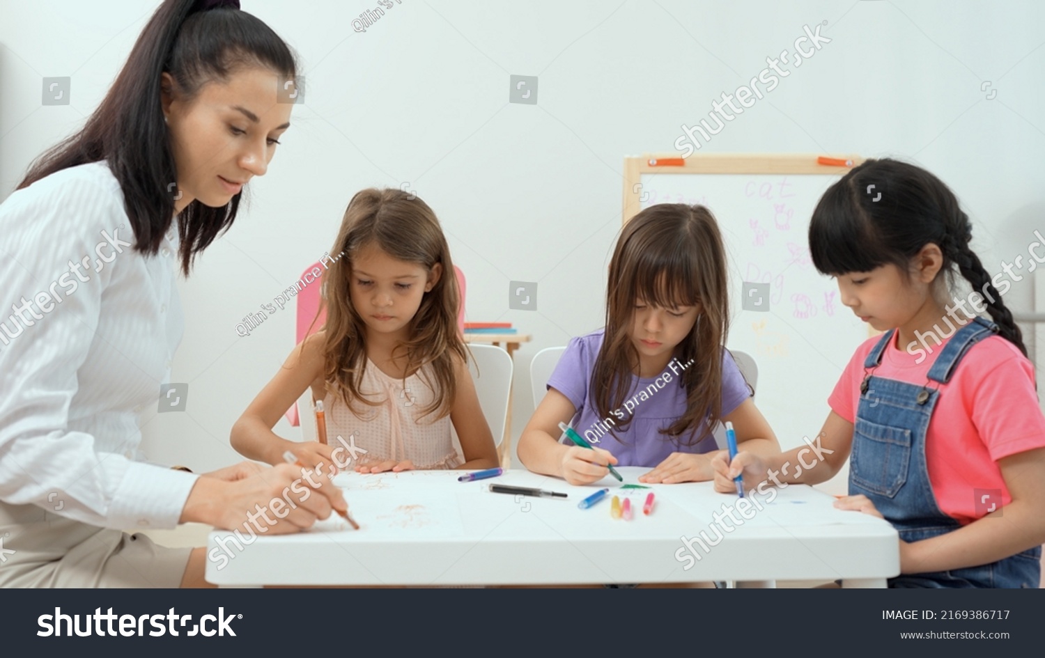 Woman Teacher Teaching Little Girl Paint Stock Photo 2169386717 ...