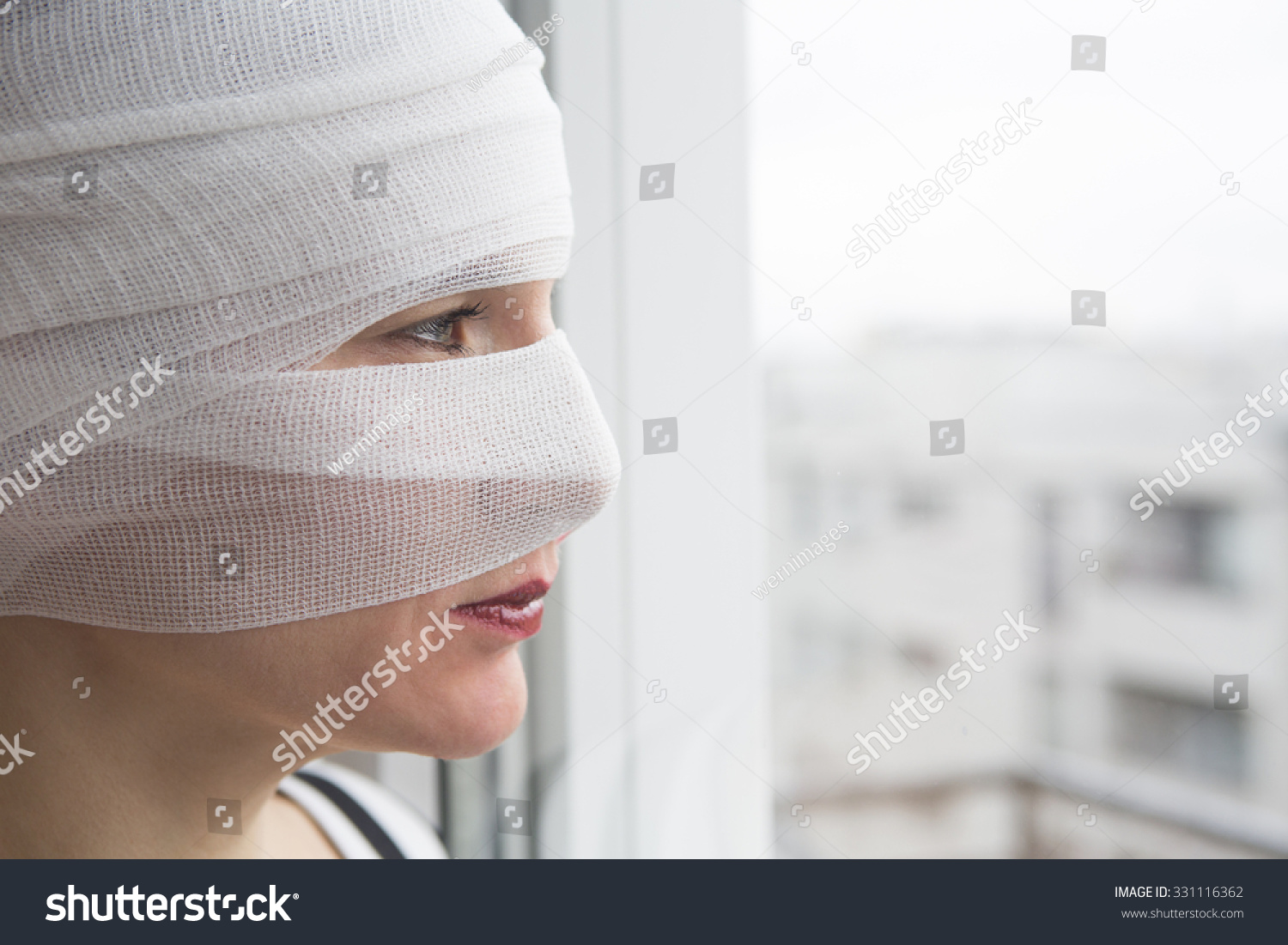 head wrapped in bandages