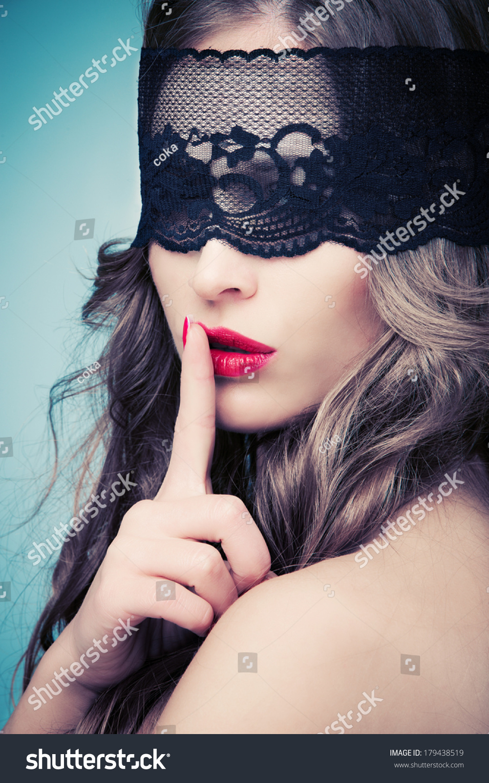stock-photo-woman-with-black-lace-over-eyes-gesturing-silence-179438519.jpg