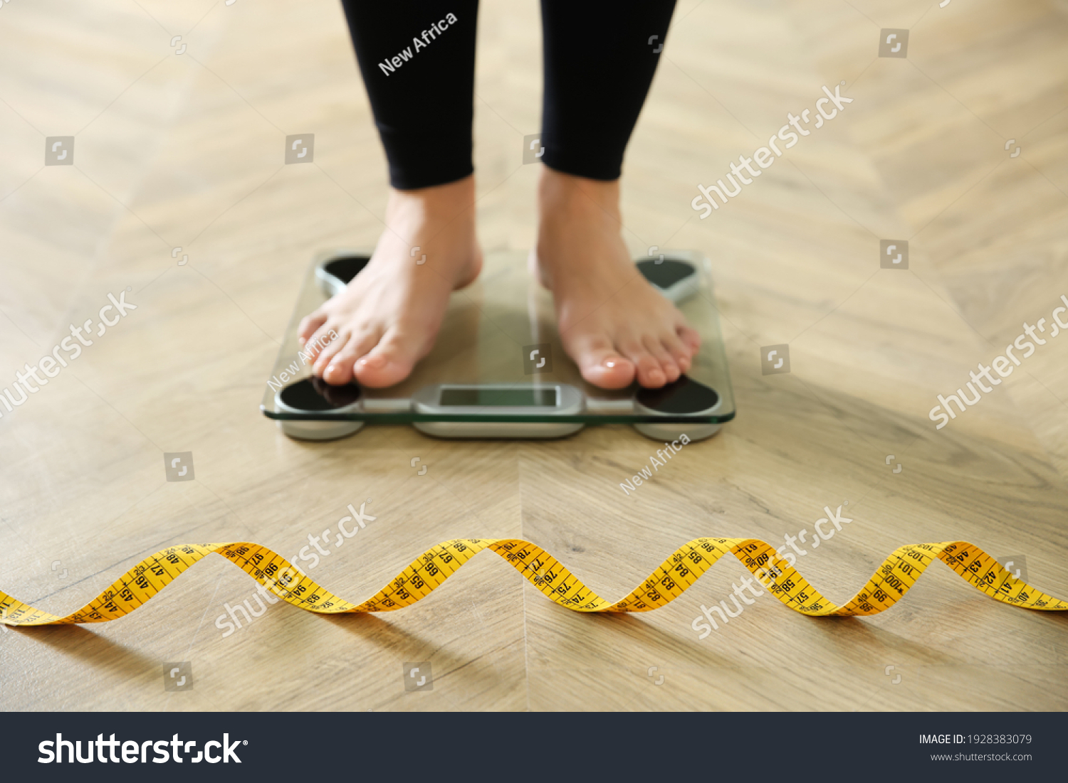 Woman Measuring Tape Standing On Scales Stock Photo Shutterstock