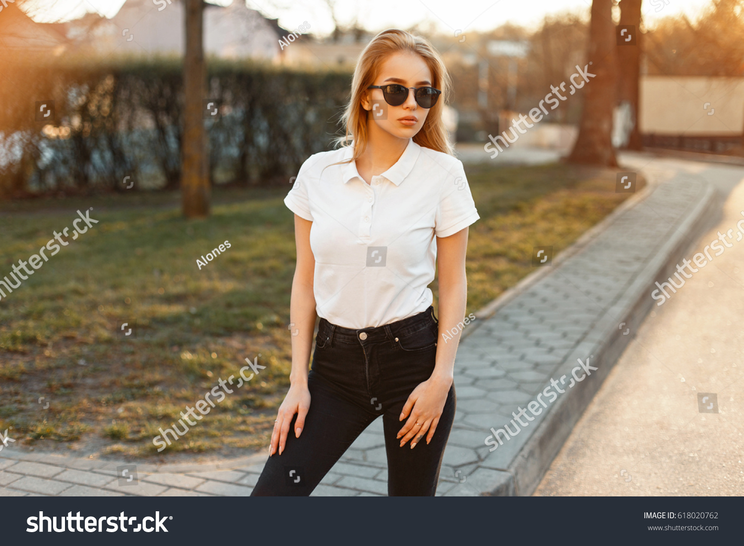 black jeans and polo shirt