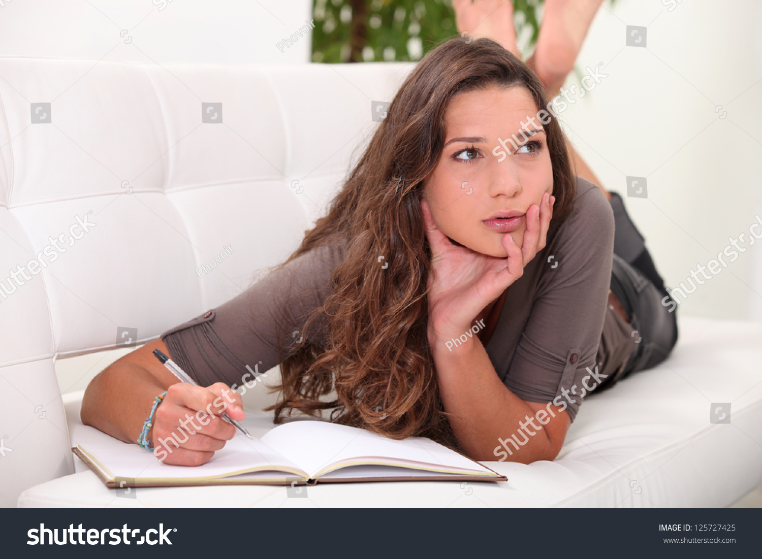 Blonde woman writing in journal - wide 6