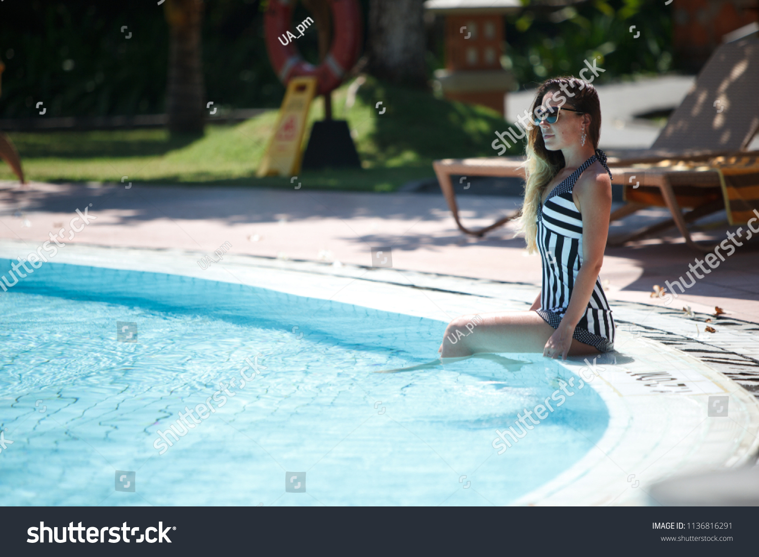 Women Stripped Swimsuite Sunbathing Pool Stock Photo (Edit Now) 1136816291