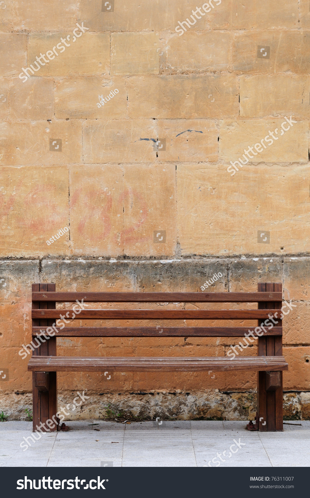 Wood Bench Against A Brick Wall Stock Photo 76311007 