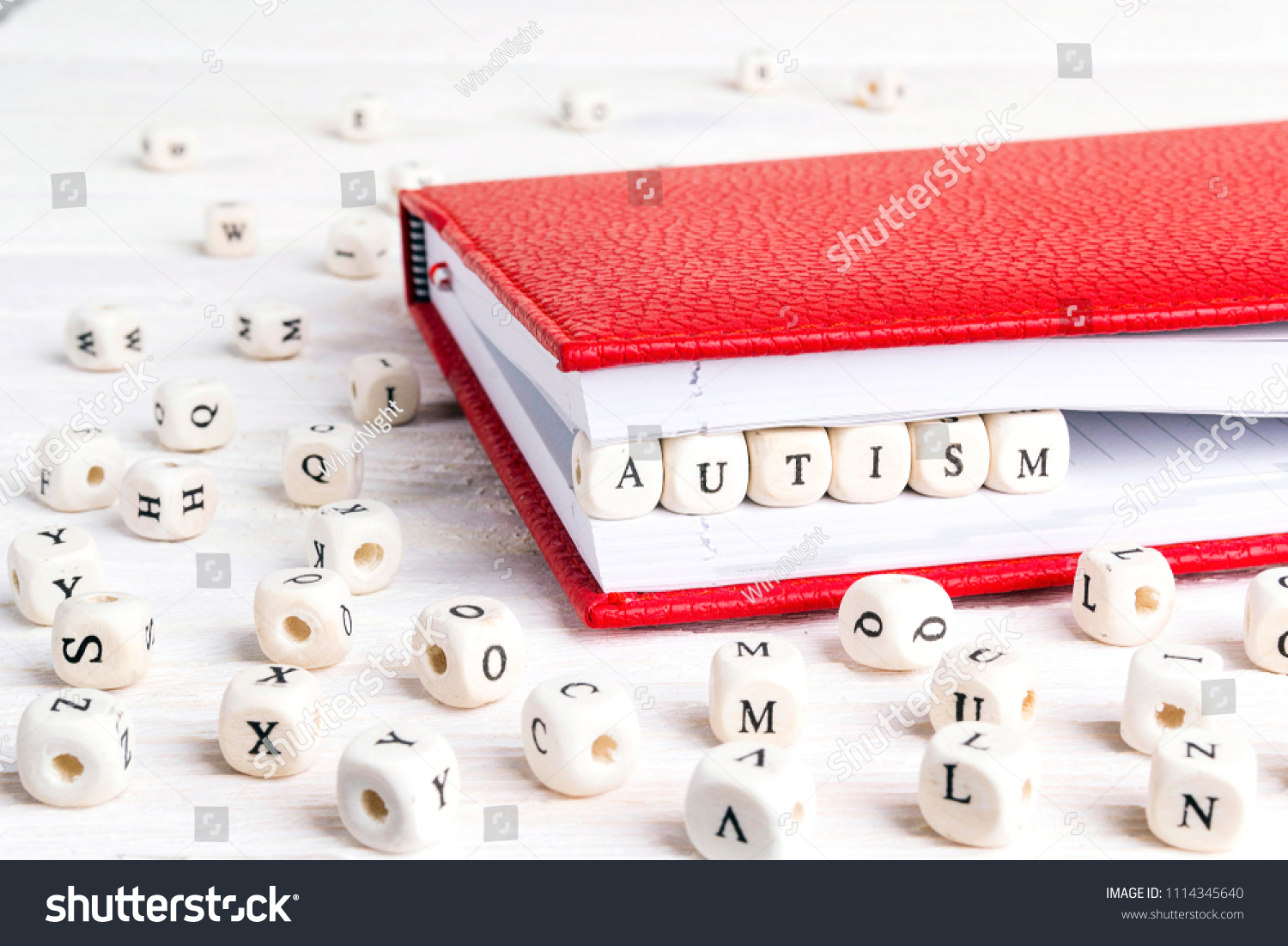 Word Autism Written Wooden Blocks Red Stock Photo Edit Now 1114345640   Stock Photo Word Autism Written In Wooden Blocks In Red Notebook On White Wooden Table Wooden Abc 1114345640 