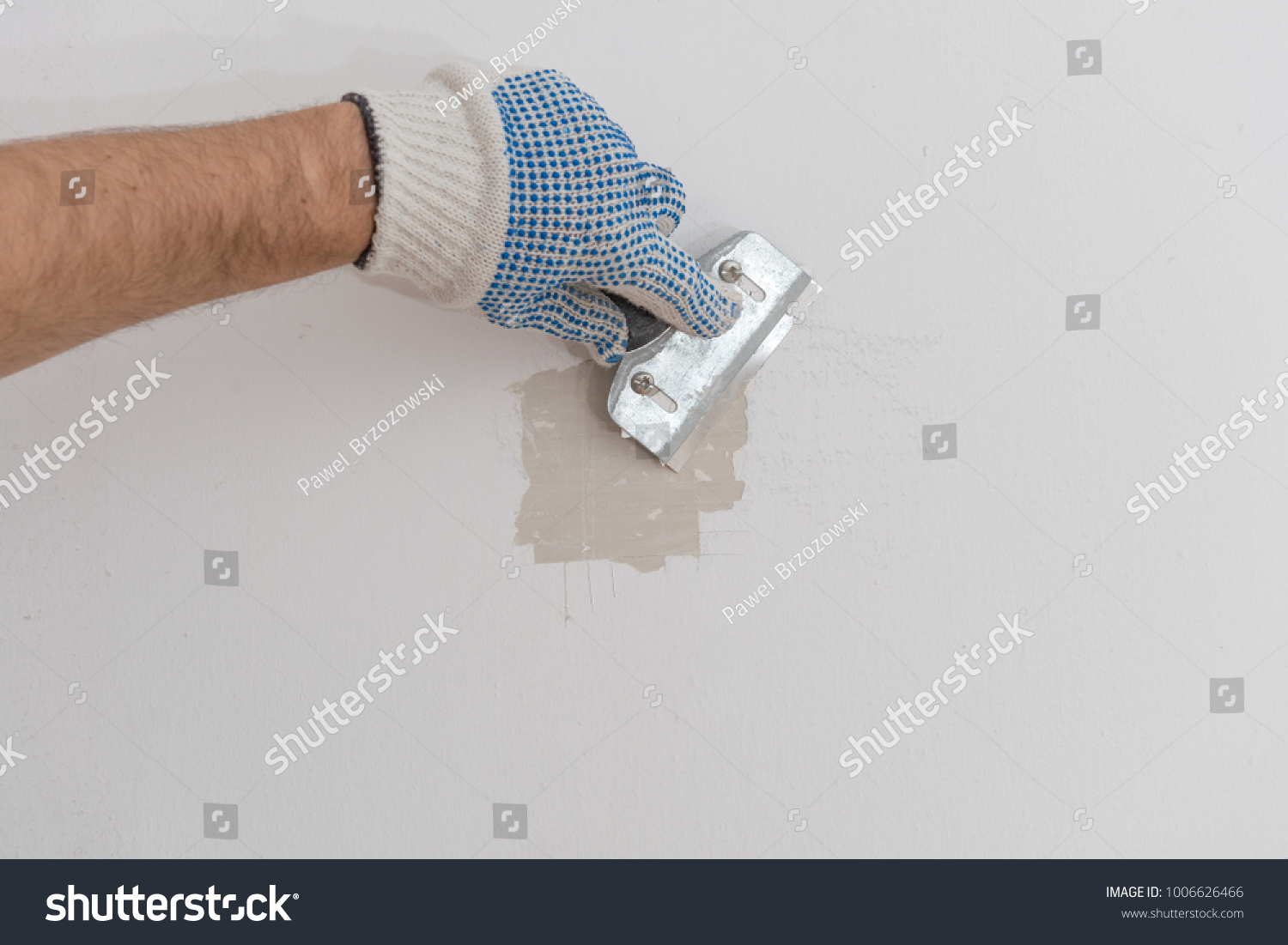 Worker Hand Scraping Old Paint On Stock Photo Royalty Free