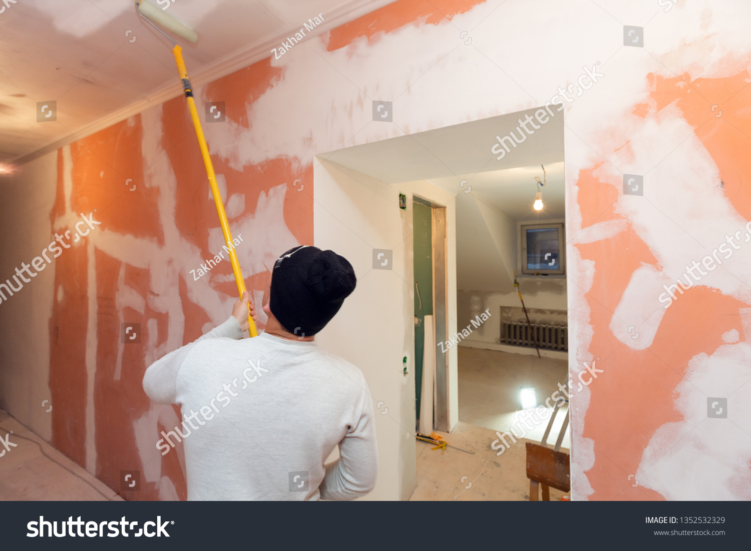 Worker Painting Ceiling By Paint Roller Stock Photo Edit