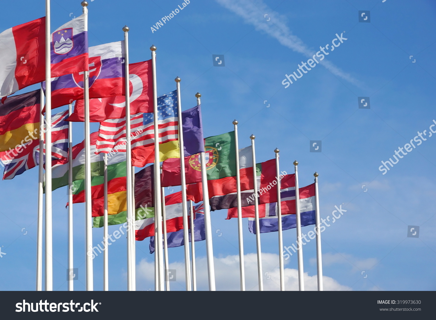 World Flags Blowing In The Wind On The Cloudy Sky Background Stock ...