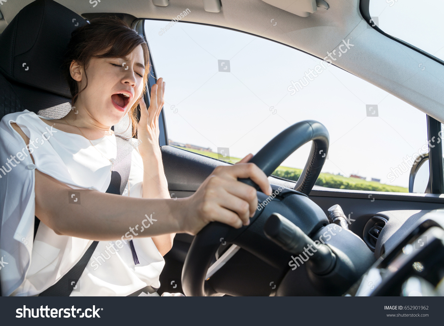 Yawning female driver falling asleep wheel stock photo edit now 652901962