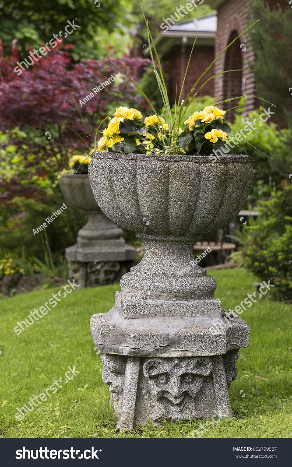 1 Concrete planters base featuring devil faces Images, Stock Photos ...