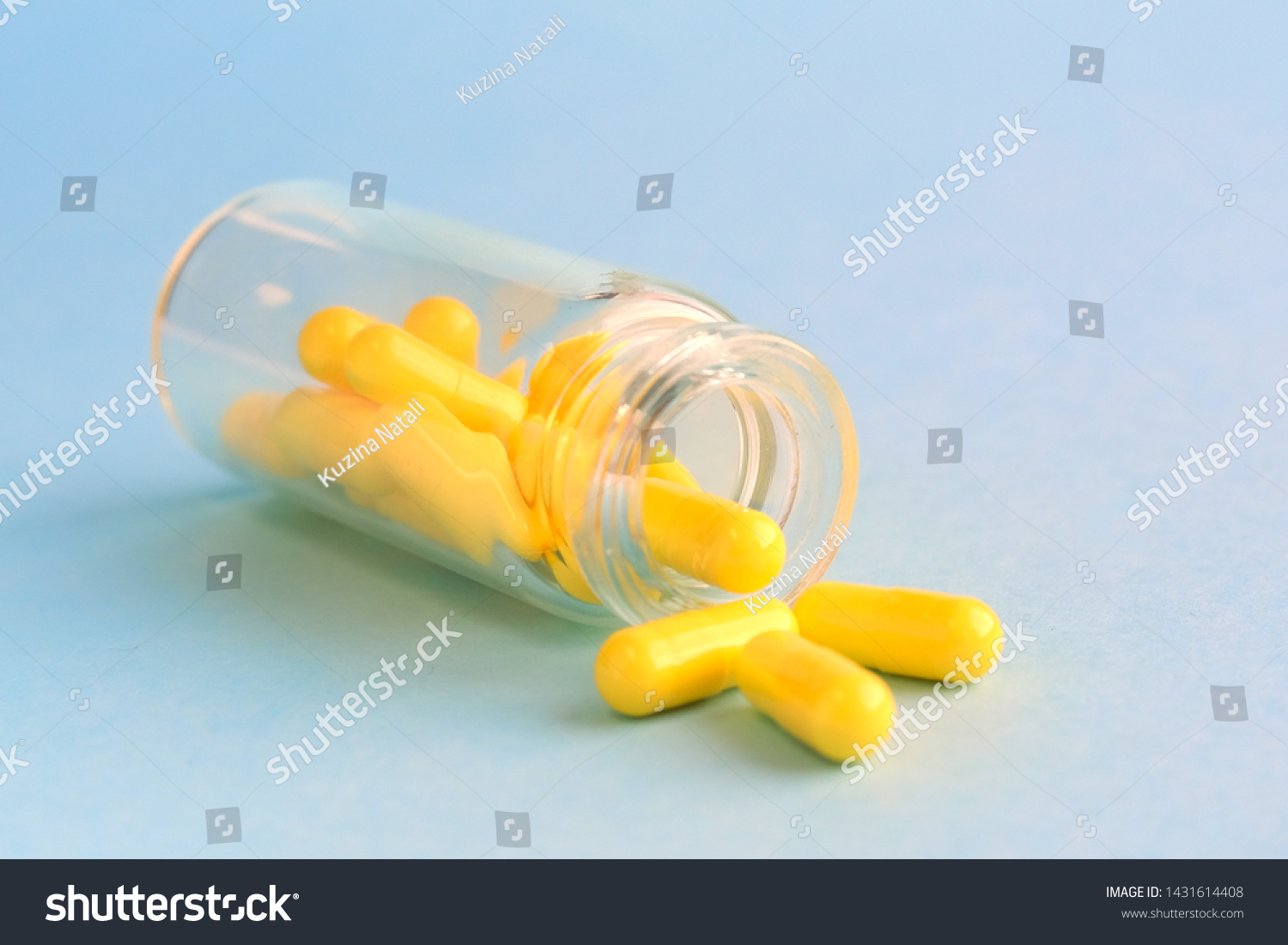 Download Yellow Capsules Glass Bottle On Blue Stock Photo Edit Now 1431614408 PSD Mockup Templates