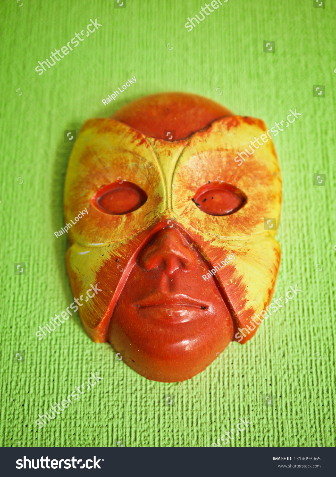 Download Yellowred Mask On Lime Green Wall Stock Photo Edit Now 1314093965 PSD Mockup Templates