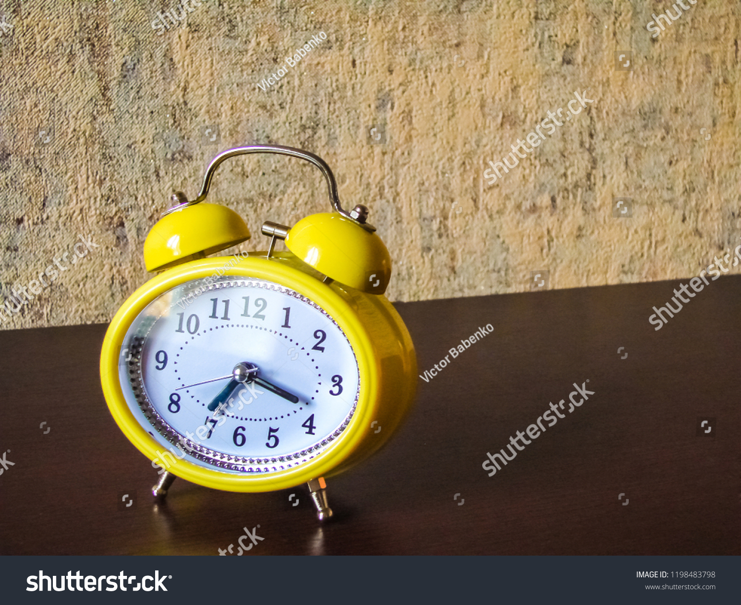 Yellow Retrostyle Alarm Clock On Brown Stock Photo Edit Now 1198483798