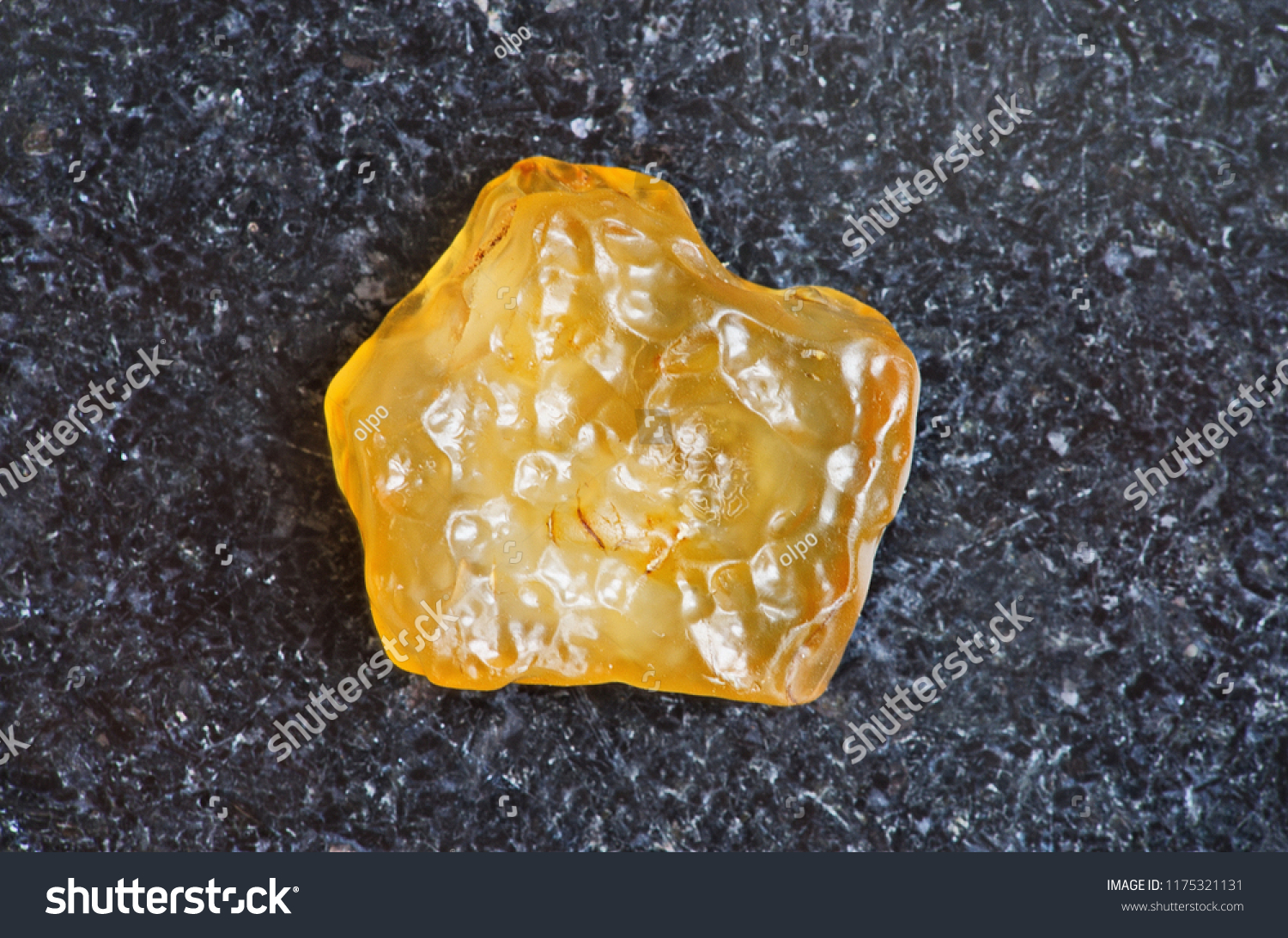 7 Libyan Desert Glass Images Stock Photos Vectors Shutterstock   Stock Photo Yellow Tektite Specimen On Dark Granite Background Close Up Libyan Desert Glass 1175321131 