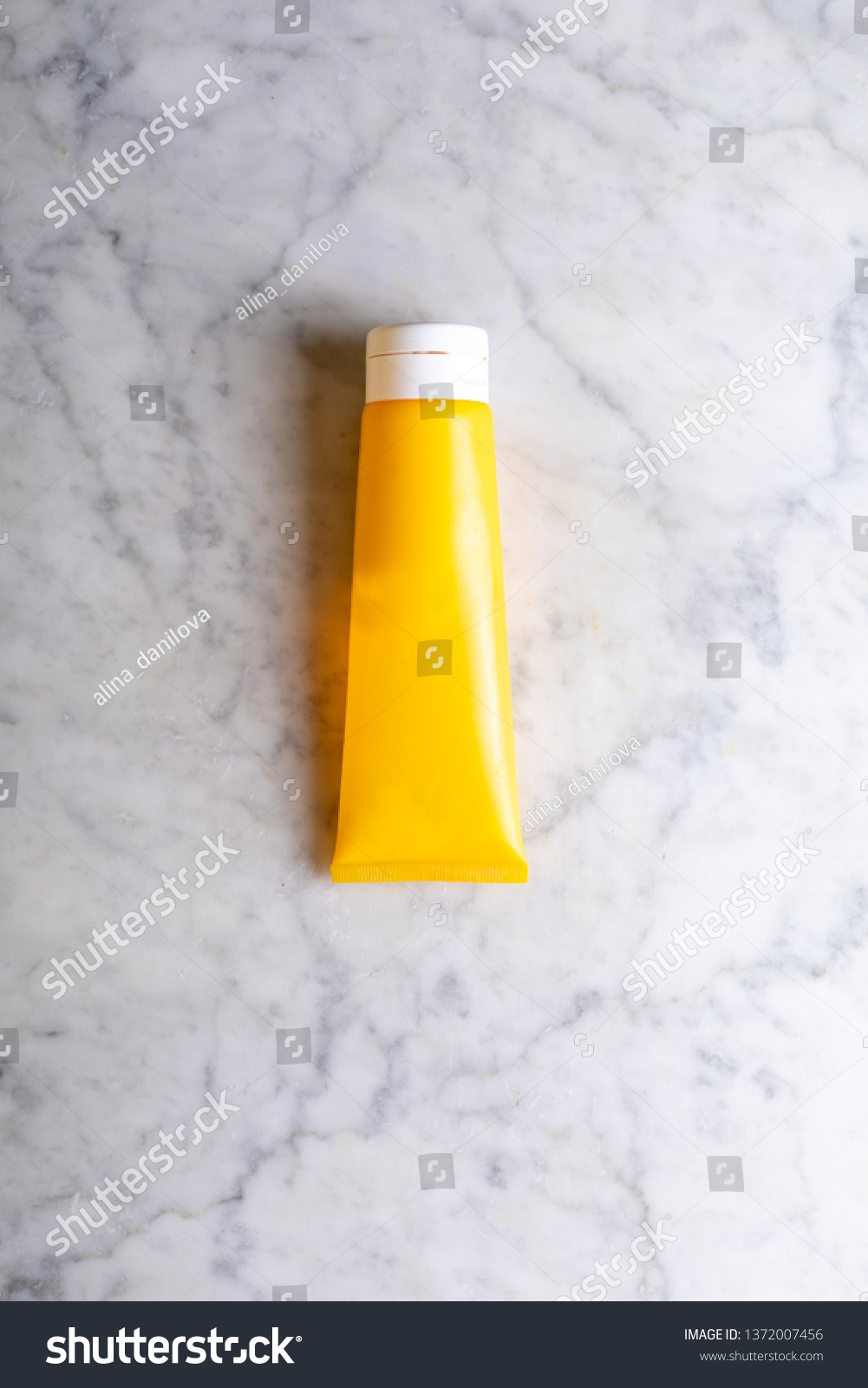 Download Yellow Tube Cream On Marble Background Stock Photo Edit Now 1372007456 Yellowimages Mockups