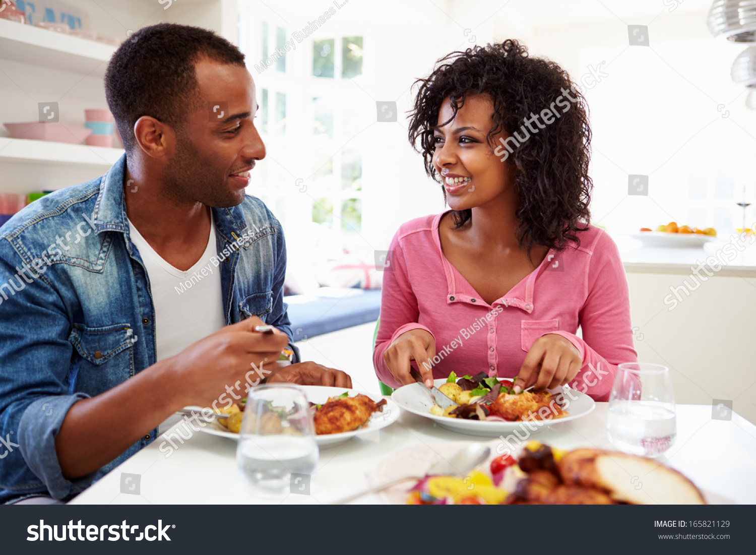 Young African American Couple Eating Meal Stock Photo 165821129 ...