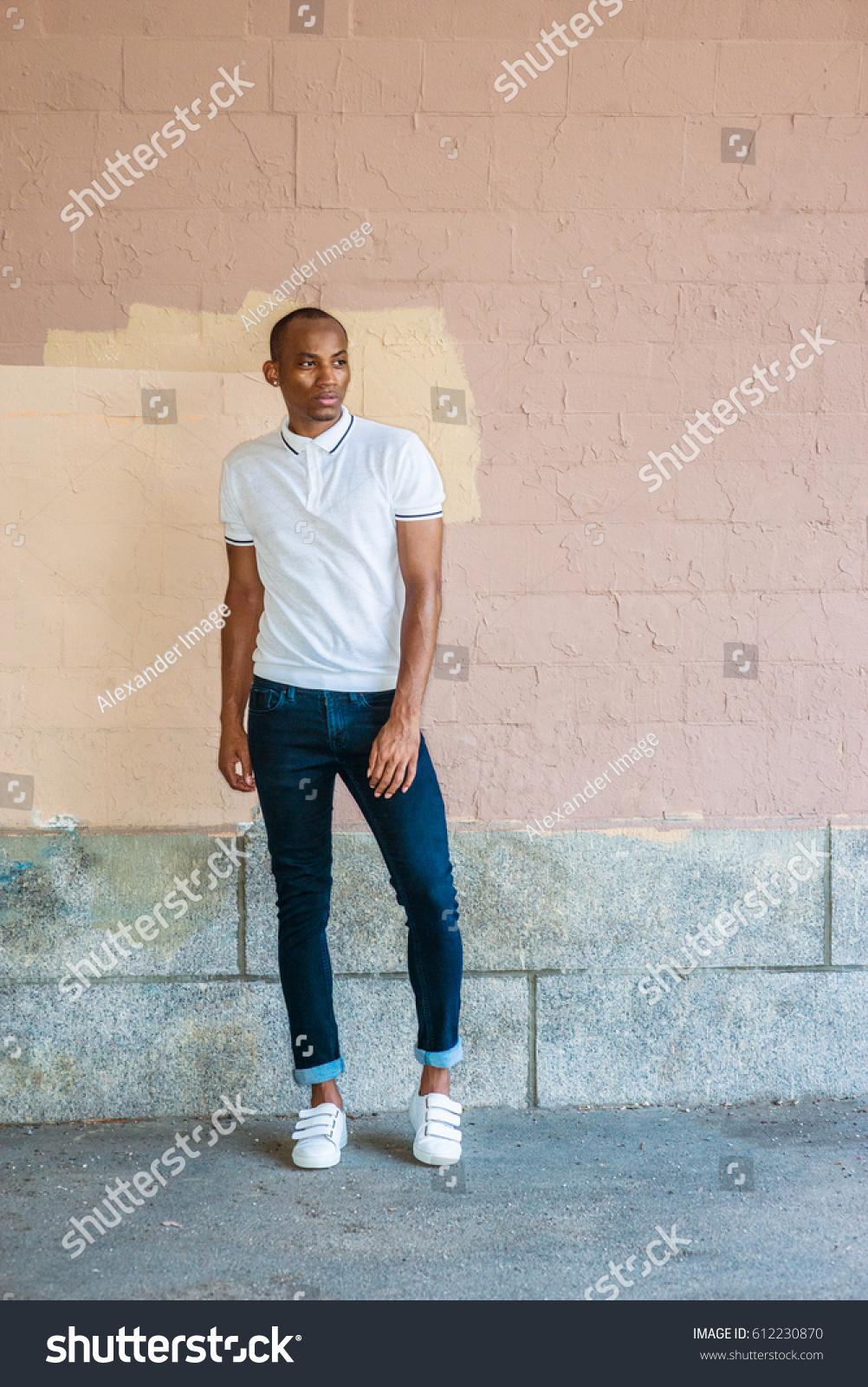 white polo shirt and blue jeans