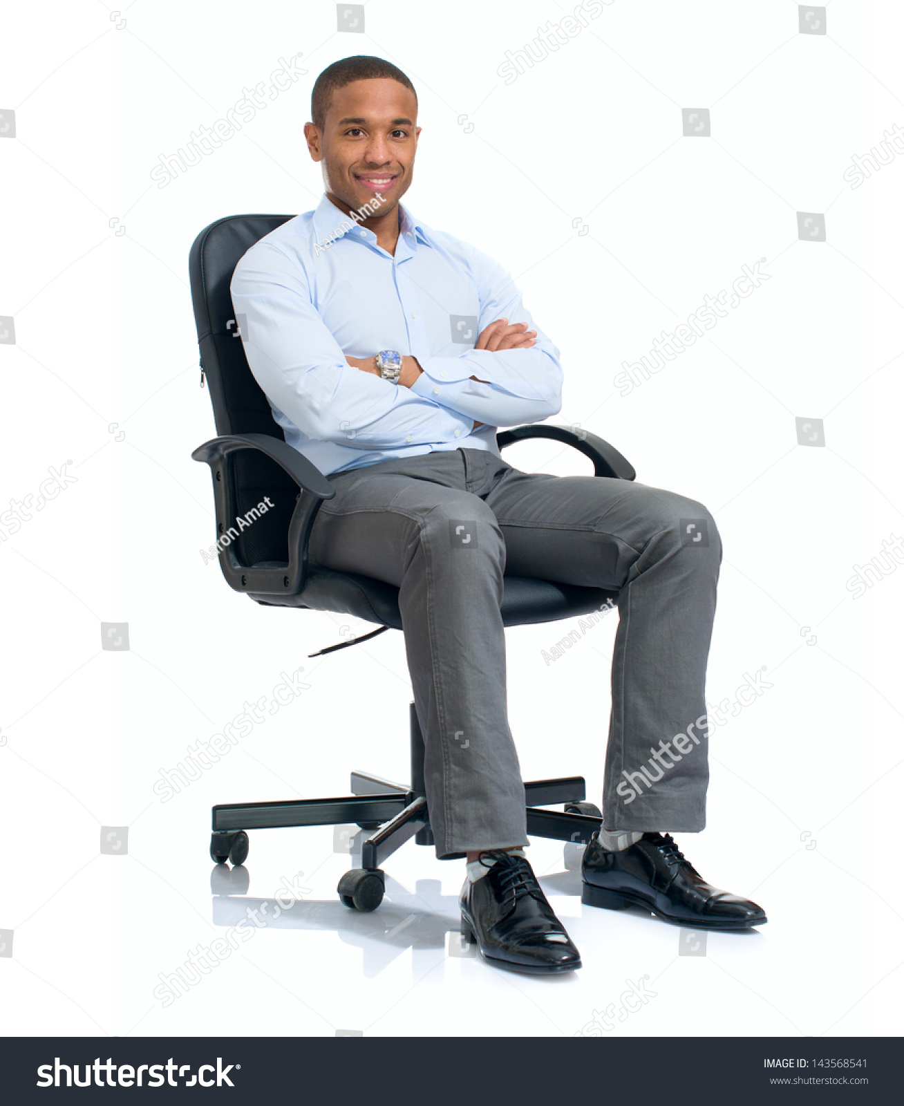 stock-photo-young-african-businessman-sitting-on-chair-over-white-background-143568541.jpg