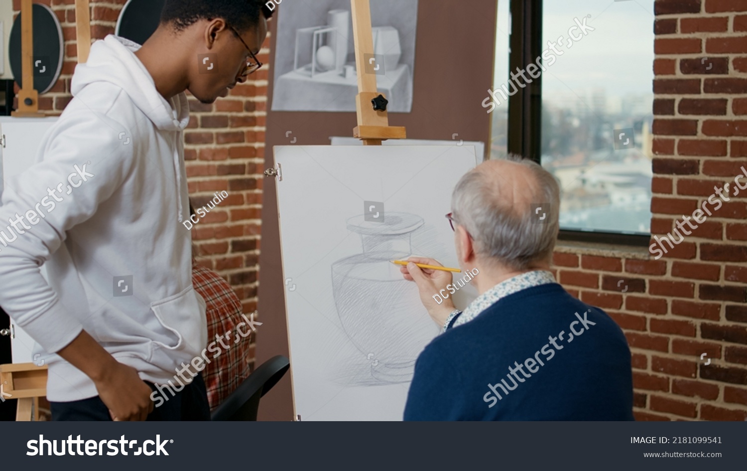 Young Artist Explaining Drawing Technique Elder Stock Photo 2181099541