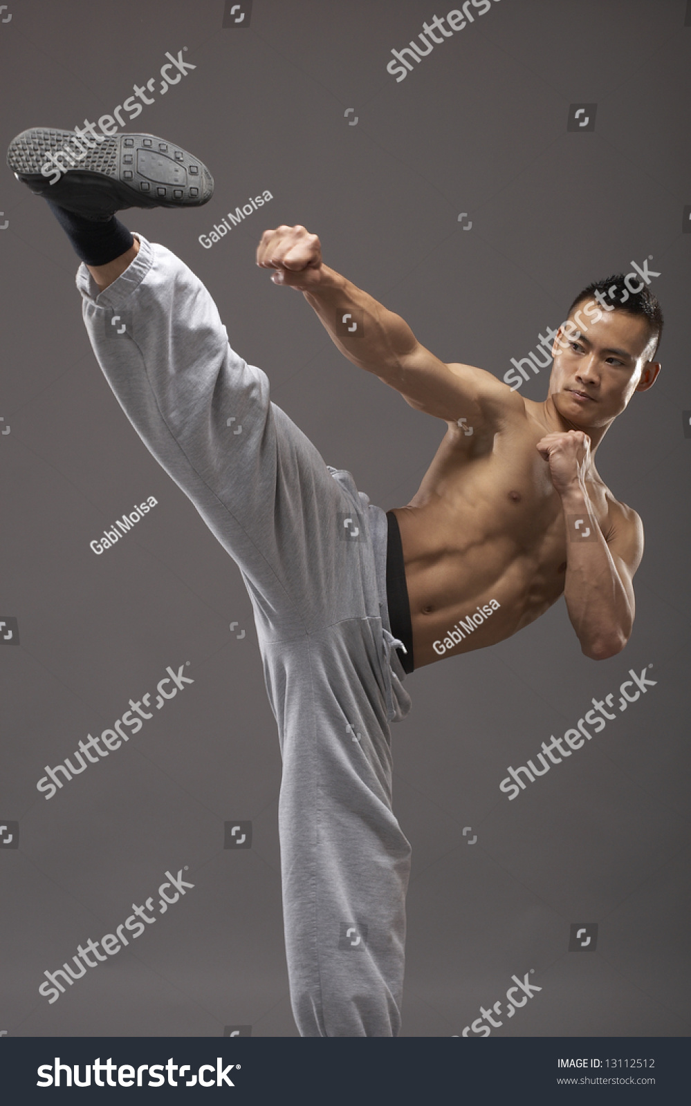 Young Asian Martial Arts Man Over Gray Background Stock Photo 13112512 ...