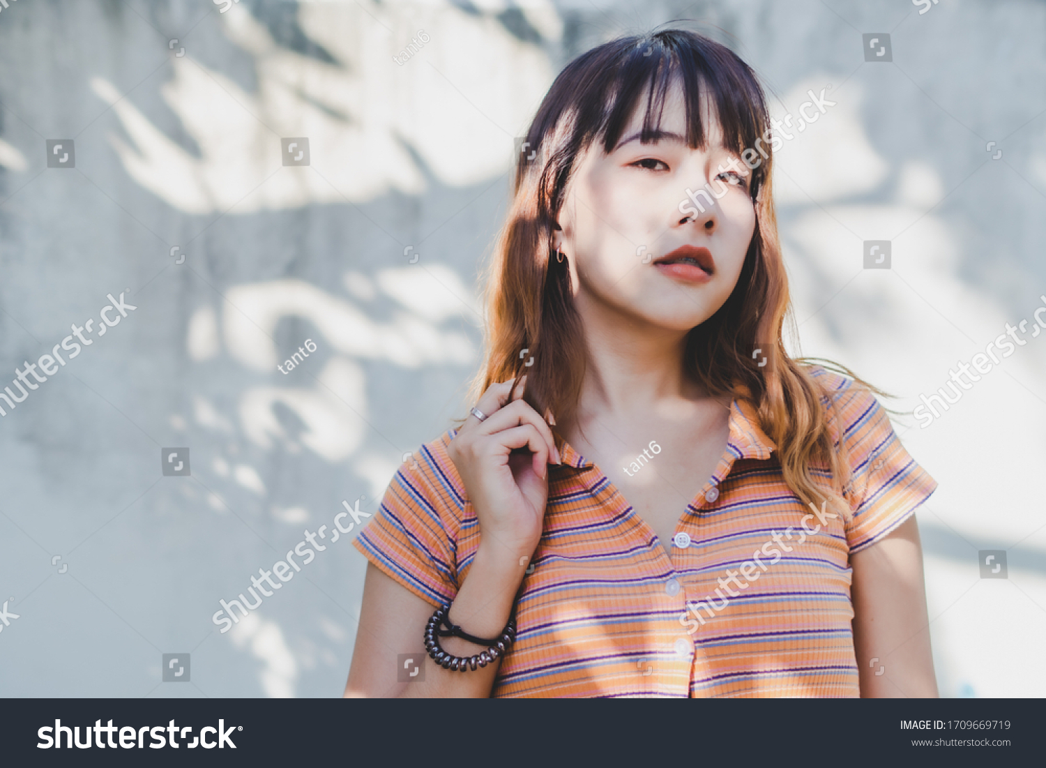 young-asian-woman-take-photo-light-stock-photo-1709669719-shutterstock