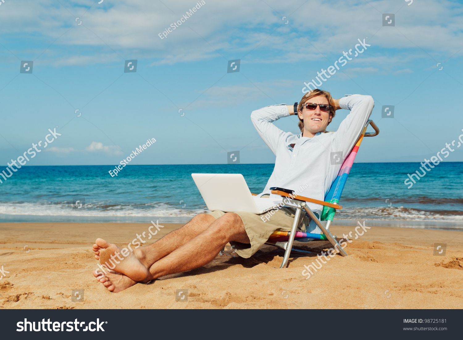 Young Attractive Man Relaxing At The Beach With Laptop Computer Stock ...