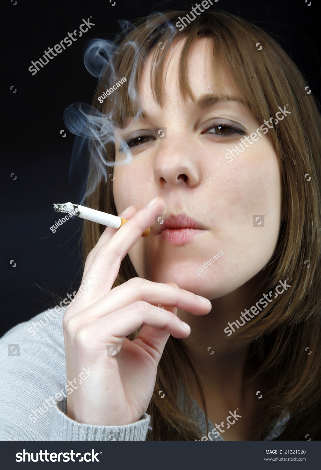 Young Beautiful Girl Smoking Cigarette Stock Photo 21221020 : Shutterstock