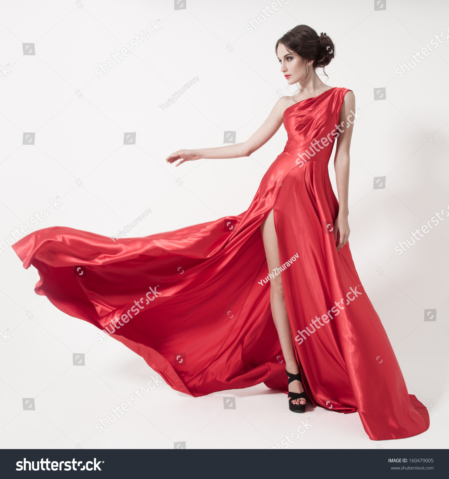 Young Beauty Woman In Fluttering Red Dress. White Background. Stock ...