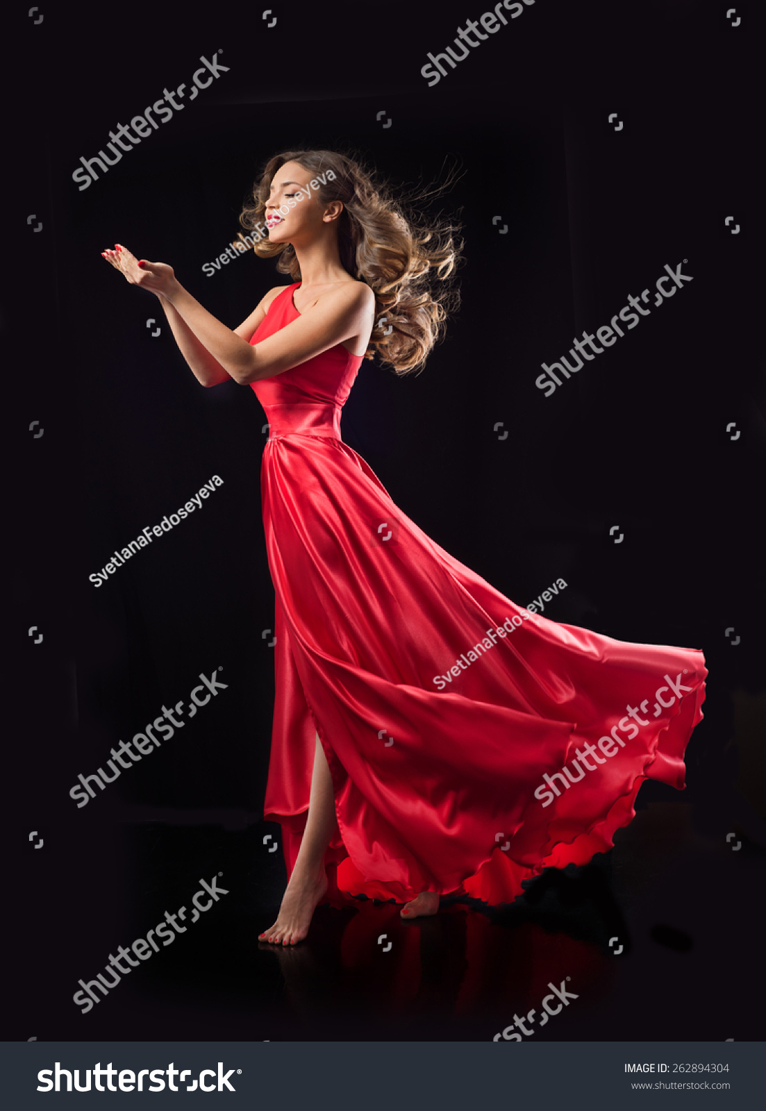 Young Beauty Woman In Red Waving Flying Dress. Dancer In Silk Dress ...