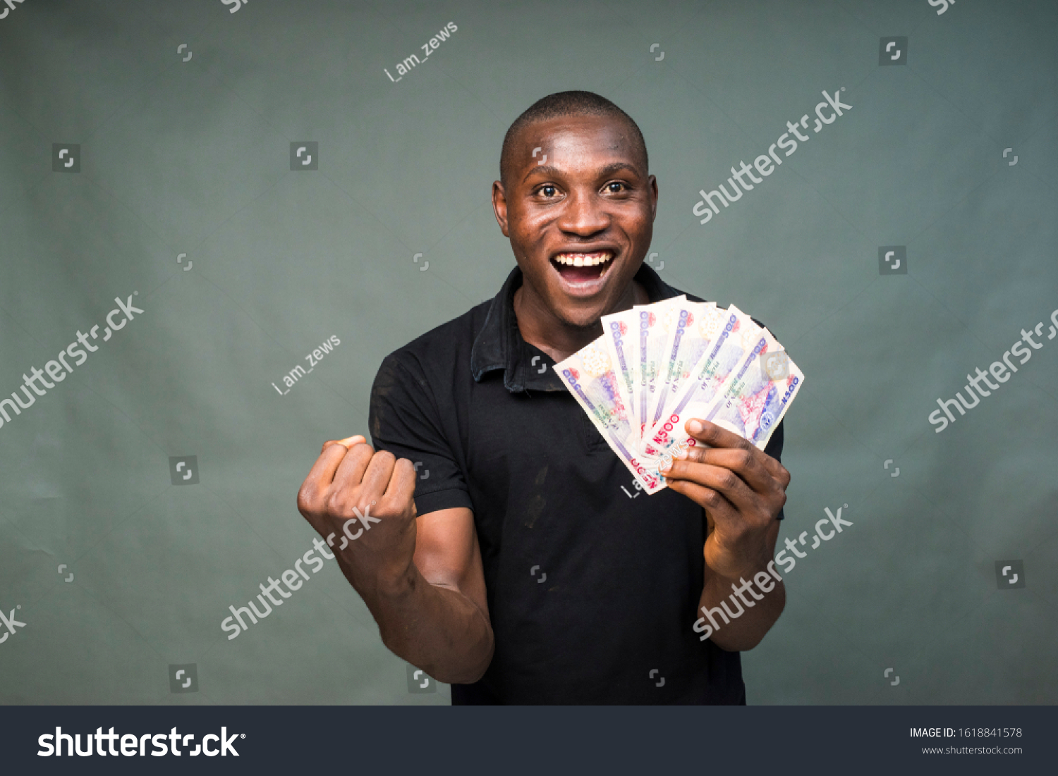 Young Black Man Holding Some Cash Stock Photo 1618841578 | Shutterstock