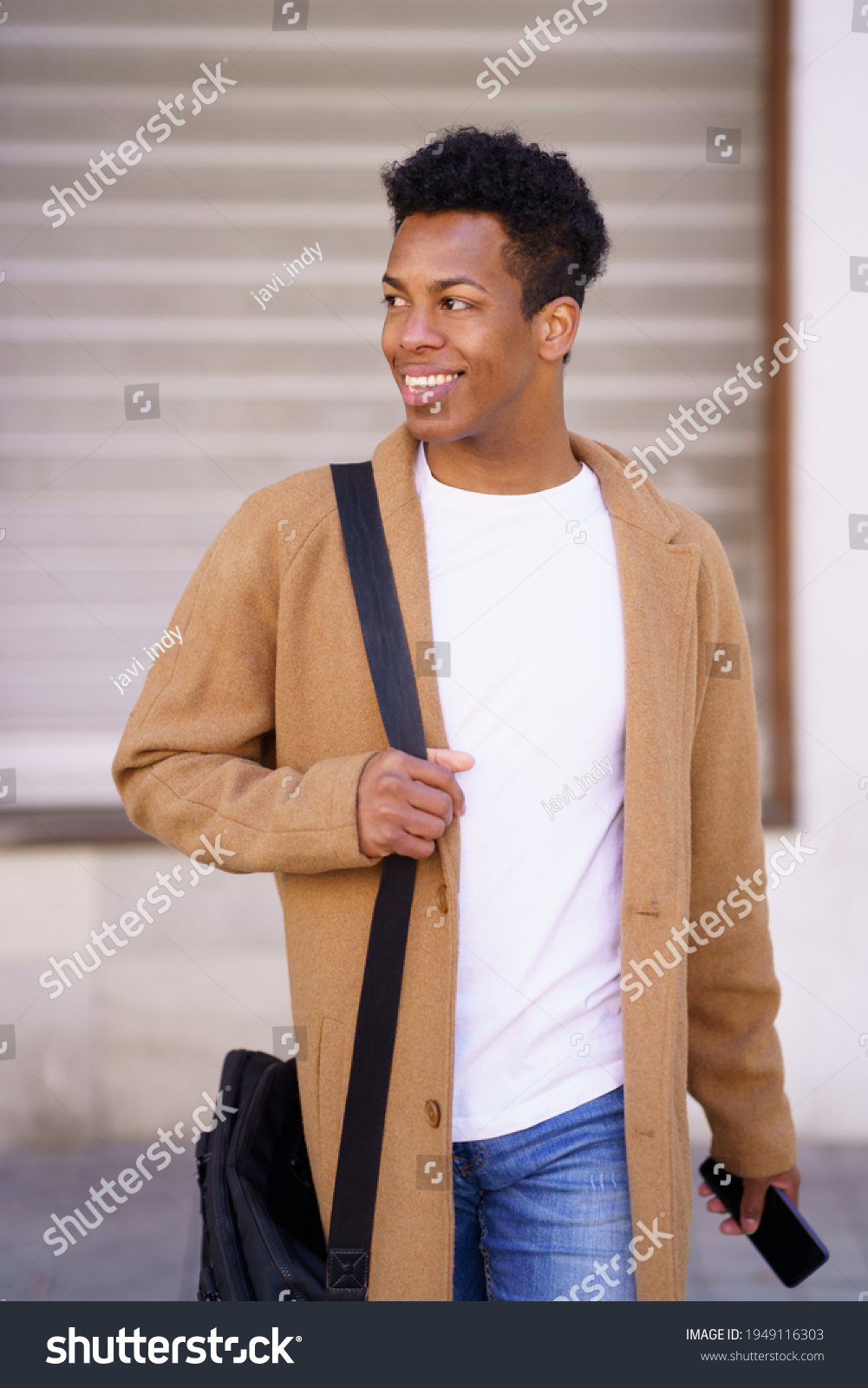 Young Black Man Walking Down Street Stock Photo 1949116303 | Shutterstock