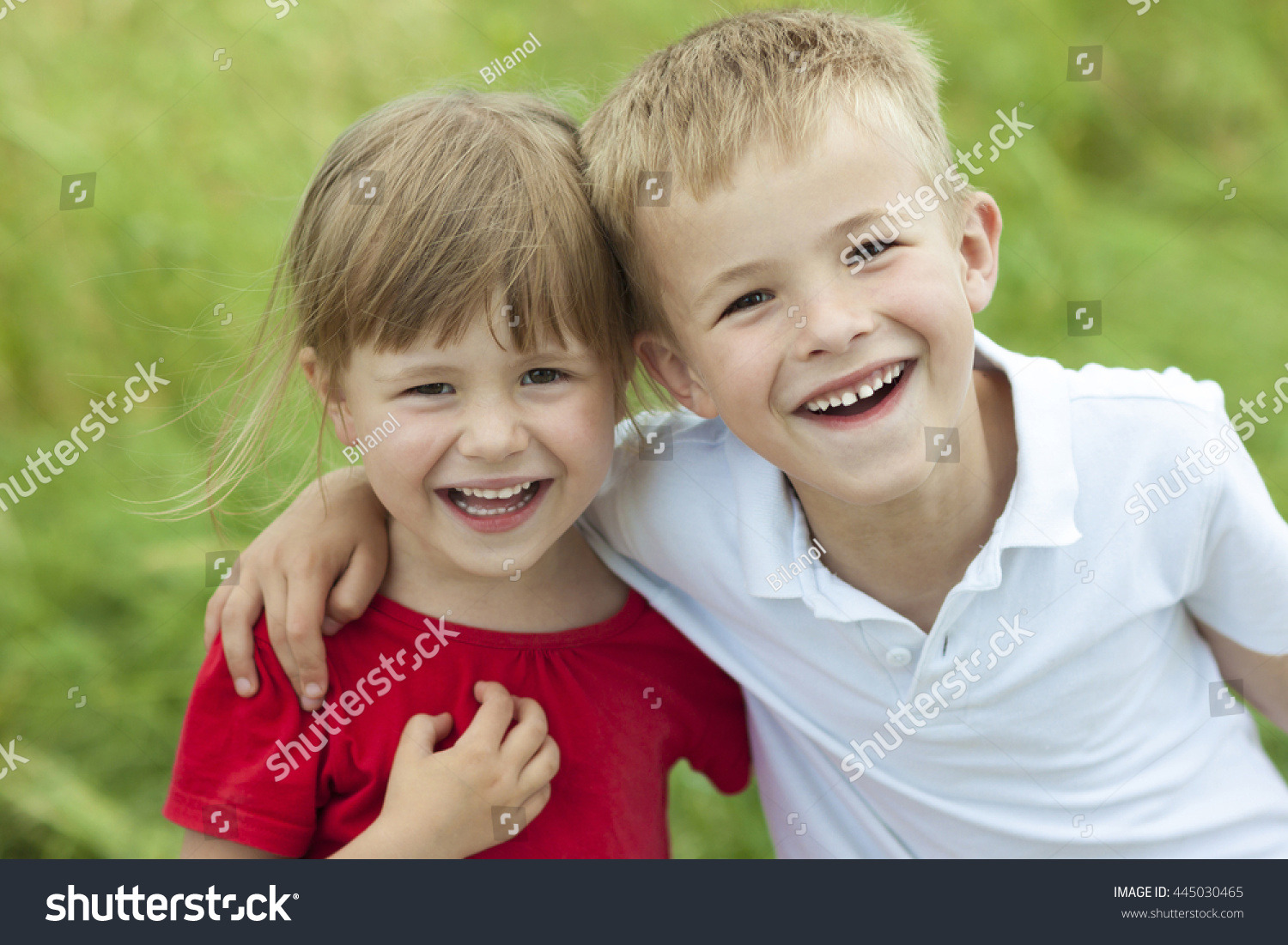 Young Boy And Girl Together Laughing Happily Stock Photo 445030465 ...