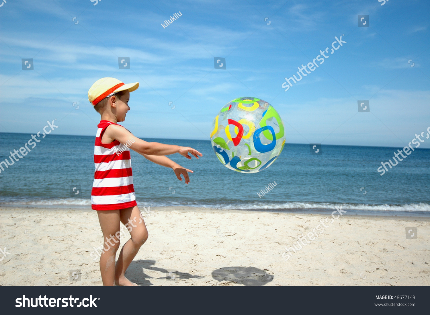 Young Boy Playing Beach Ball By Stock Photo 48677149 - Shutterstock