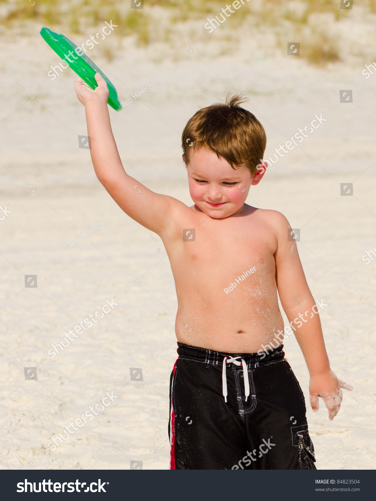 Young Boy Playing Frisbee On Beach. Stock Photo 84823504 : Shutterstock