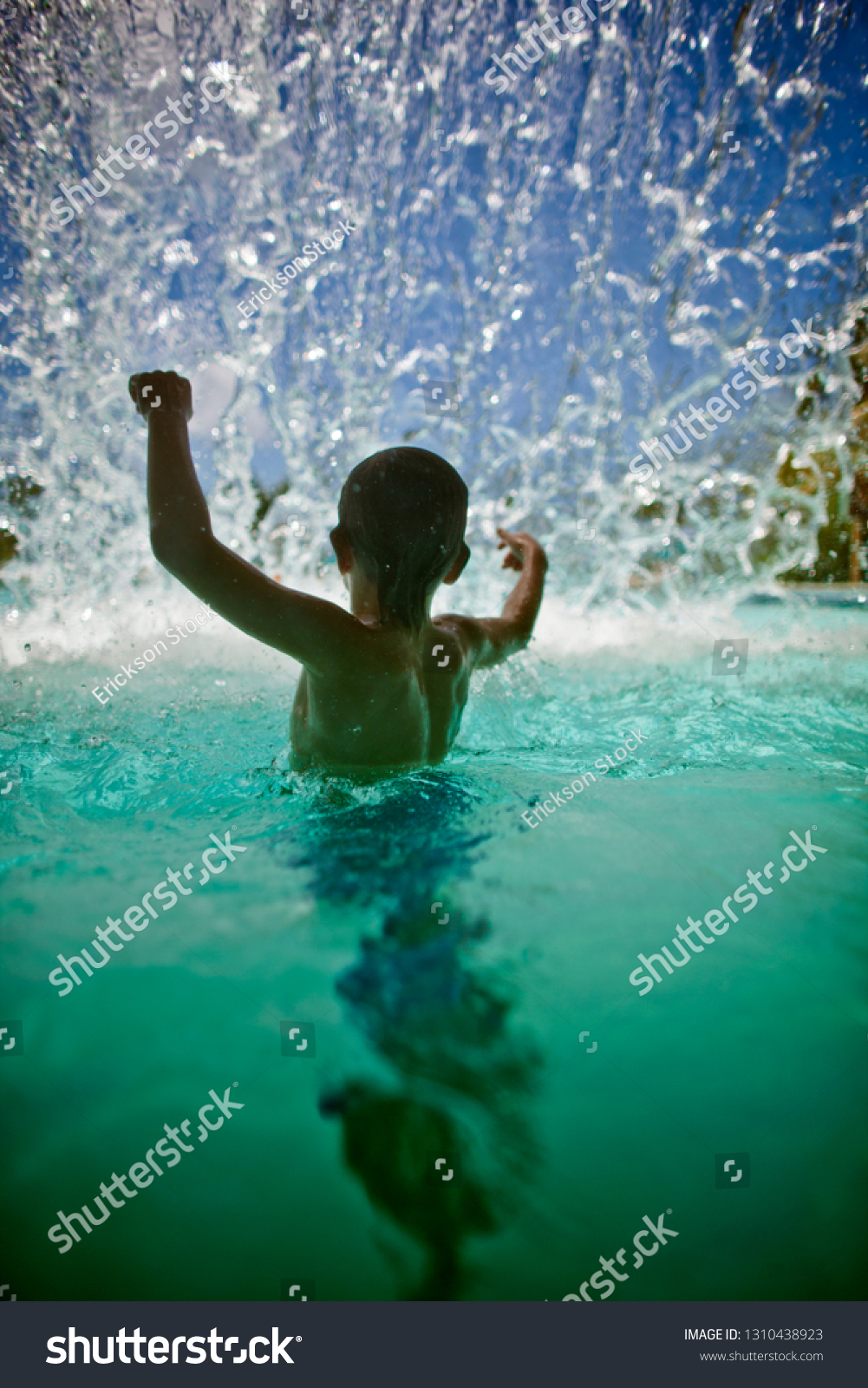 Young Boy Splashing Swimming Pool Blur Stock Photo 1310438923