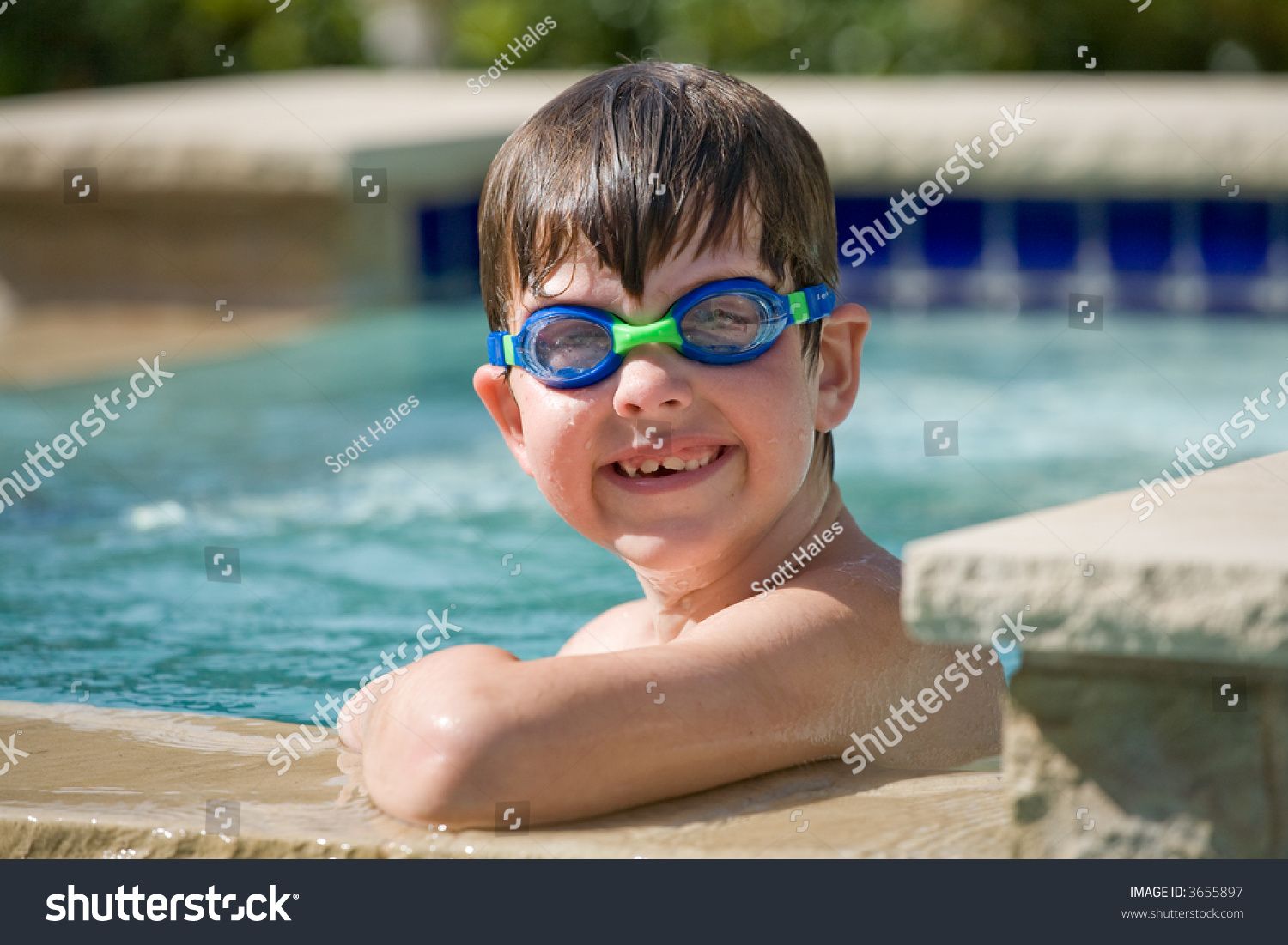 Shirtless boy standing in swimming pool Stock Photo - Alamy