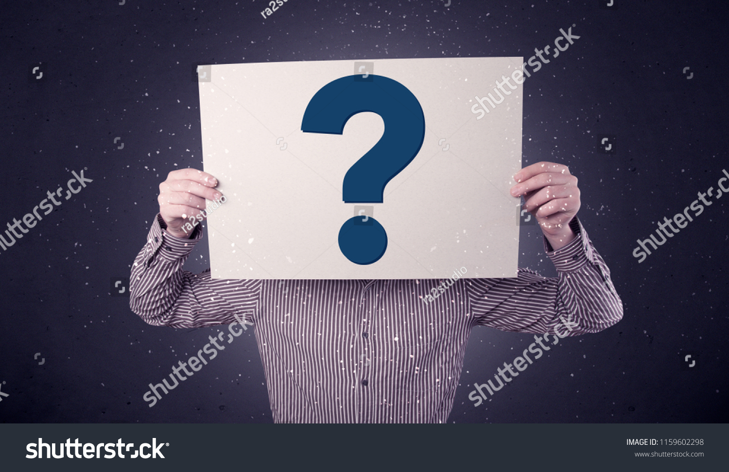 Young Businessman Hiding Behind Question Mark Stock Photo Edit Now young-businessman-hiding-behind-question-mark-stock-photo-edit-now